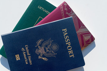 Multiple passports - Dark blue US Passport Alongside EU Style Red and Green Passports