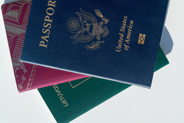 Multiple passports - Dark blue US Passport Alongside EU Style Red and Green Passports
