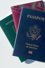 Multiple passports - Dark blue US Passport Alongside EU Style Red and Green Passports