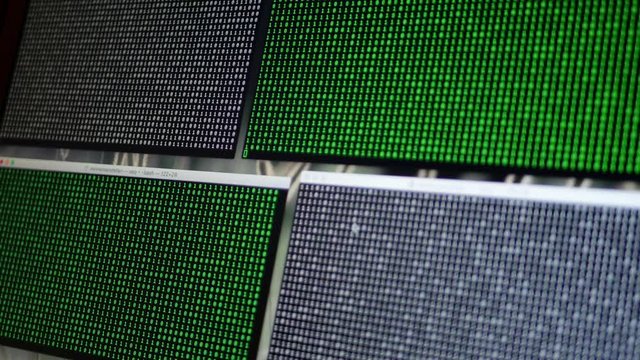 Endless lines of computer code falling on screen - cyber attack hack matrix concept