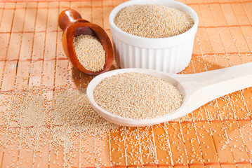 Raw Organic Amaranth grain on wooden table