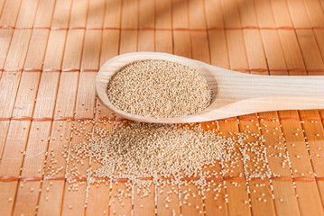 Raw Organic Amaranth grain on wooden table