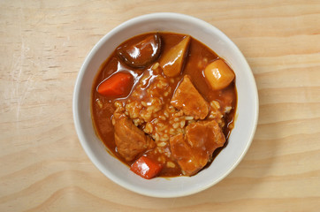 Pork curry with rice in a bowl
