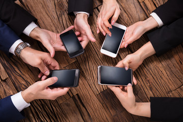 Businesspeople Using Mobile Phone