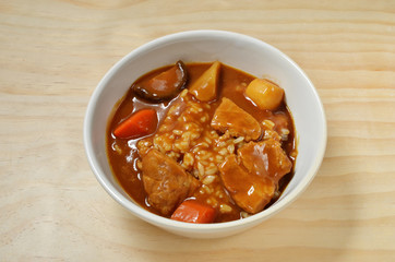 Pork curry with rice in a bowl