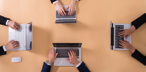 Businesspeople Working On Laptop