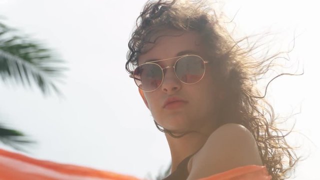 Young girl fashion model posing in pareo