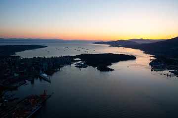 Aerial view of Downtown Vancouver, British Columbia, Canada. Taken during a vibrant sunset.