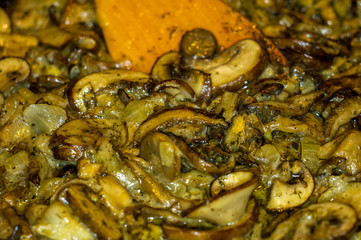 fried with onions and spices Royal mushrooms champignons in a frying pan