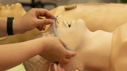 Photograph demonstrate measurement of a proper size of nasal airway