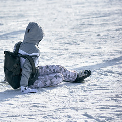 Fototapeta na wymiar Sporty woman skier after fall on winter resort