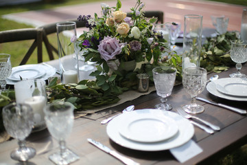 Rustic Wedding Decor Pink, Peach, Purple, and Green Floral Centerpieces on a Wooden Farm Table