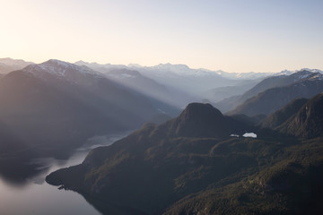 Striking Aerial View of the Canadian Mountain Landscape during a vibrant sunny day. Taken at Pitt Lake, North of Vancouver, British Columbia, Canada.