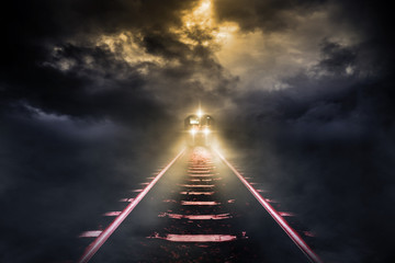Old trains run through at night on sky cloud storm background