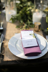 Rustic Wedding Decor Pink, Peach, Purple, and Green Floral Centerpieces on a Wooden Farm Table