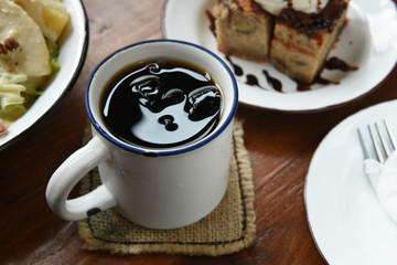 Ices coffee on the wooden table