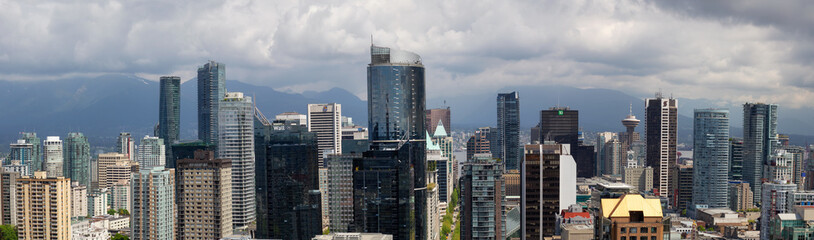 Downtown Vancouver, British Columbia, Canada - May 10, 2018: Aerial panoramic view of the modern city during a cloudy day.