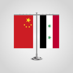 Table stand with flags of China and Syria.Two flag. Flag pole. Symbolizing the cooperation between the two countries. Table flags