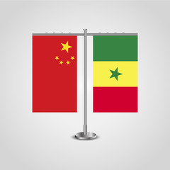 Table stand with flags of China and Senegal.Two flag. Flag pole. Symbolizing the cooperation between the two countries. Table flags