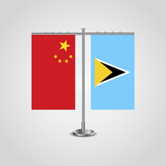 Table stand with flags of China and Saint Lucia.Two flag. Flag pole. Symbolizing the cooperation between the two countries. Table flags