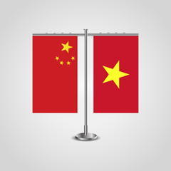 Table stand with flags of China and Vietnam.Two flag. Flag pole. Symbolizing the cooperation between the two countries. Table flags