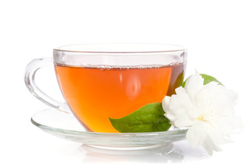 Glass cup of Tea with jasmine flowers and leaves isolated on white background