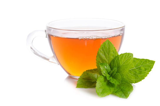 Glass cup of Tea with mint leaves isolated on white background