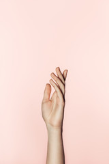  cropped shot of woman gesturing by hand isolated on pink background