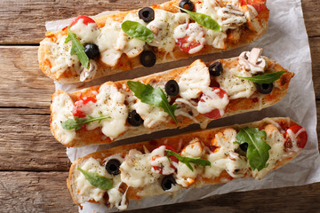 Italian sandwiches pizza casserole: cut baguette baked with chicken, cheese, tomatoes, olives and...