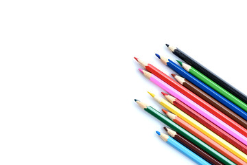 Colorful pencils, pastel and gouache isolated on white background with copy space. Drawing concept.