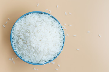 bowl of jasmine white rice on yellow backgrounds