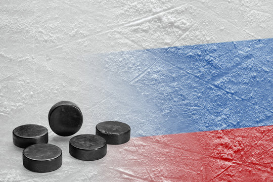 Image of the Russian flag on ice and hockey pucks