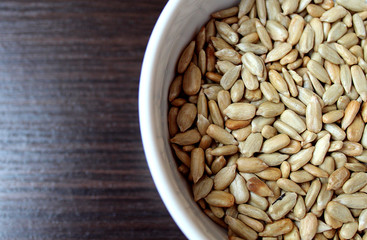 Peeled sunflower seeds lie in a plate