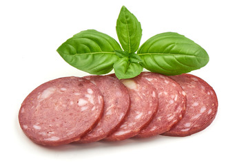 Smoked salami with green basil isolated on the white background.