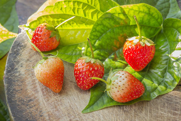 strawberries on old wooden textured table