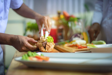 french burger prepare by chef in kitchen ready to serving in new and fresh