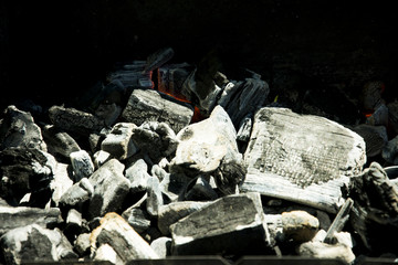 barbecue on the grill in the summer outdoors, ignition, burnt-out coal smoldering