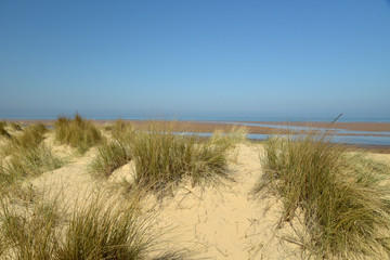 Fototapeta na wymiar Path through sand dunes on Holkham Beach in Norfolk