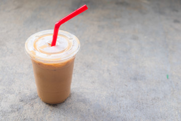 Delicious iced coffee latte with red straw