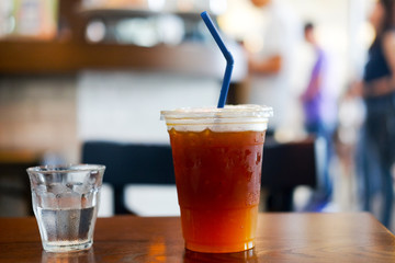 Orange and coffee cocktail on the wooden table