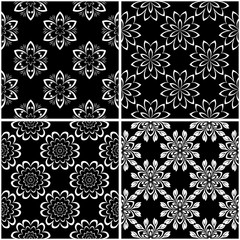 Floral patterns. Set of black and white seamless backgrounds