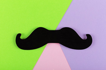 Father's Day. Minimalism. mustache. Symbol of Father's Day. colorful, paper, background