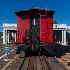 Back door of the old locomotive wagon. Locomotive door details. View to the door of the steam locomotive