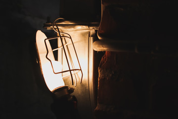 Close up of Illuminated light bulb vintage style with copy space.