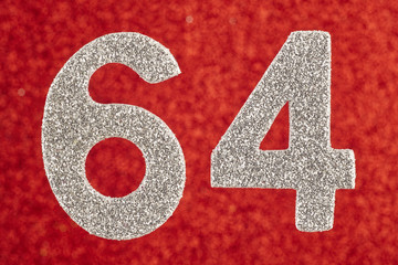 Number sixty-four silver color over a red background. Anniversary