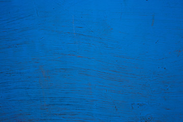 the surface is painted with blue paint, old wall