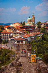 Beautiful view over the old town with a traditional architecture of Veliko Tarnovo on a sunny summer day in Bulgaria - obrazy, fototapety, plakaty