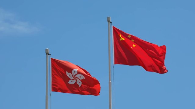 Hong Kong And Chinese Flag With Blue Sky 