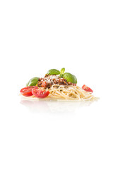 Spaghetti bolognese basil tomatoes and parmesan cheese isolated on white