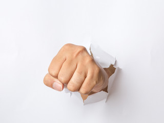 hand punching through the paper